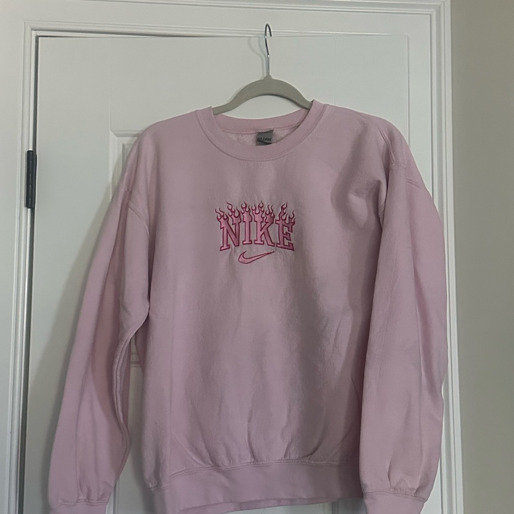 Nike Women's Pink Flaming Logo Crew Neck Sweater